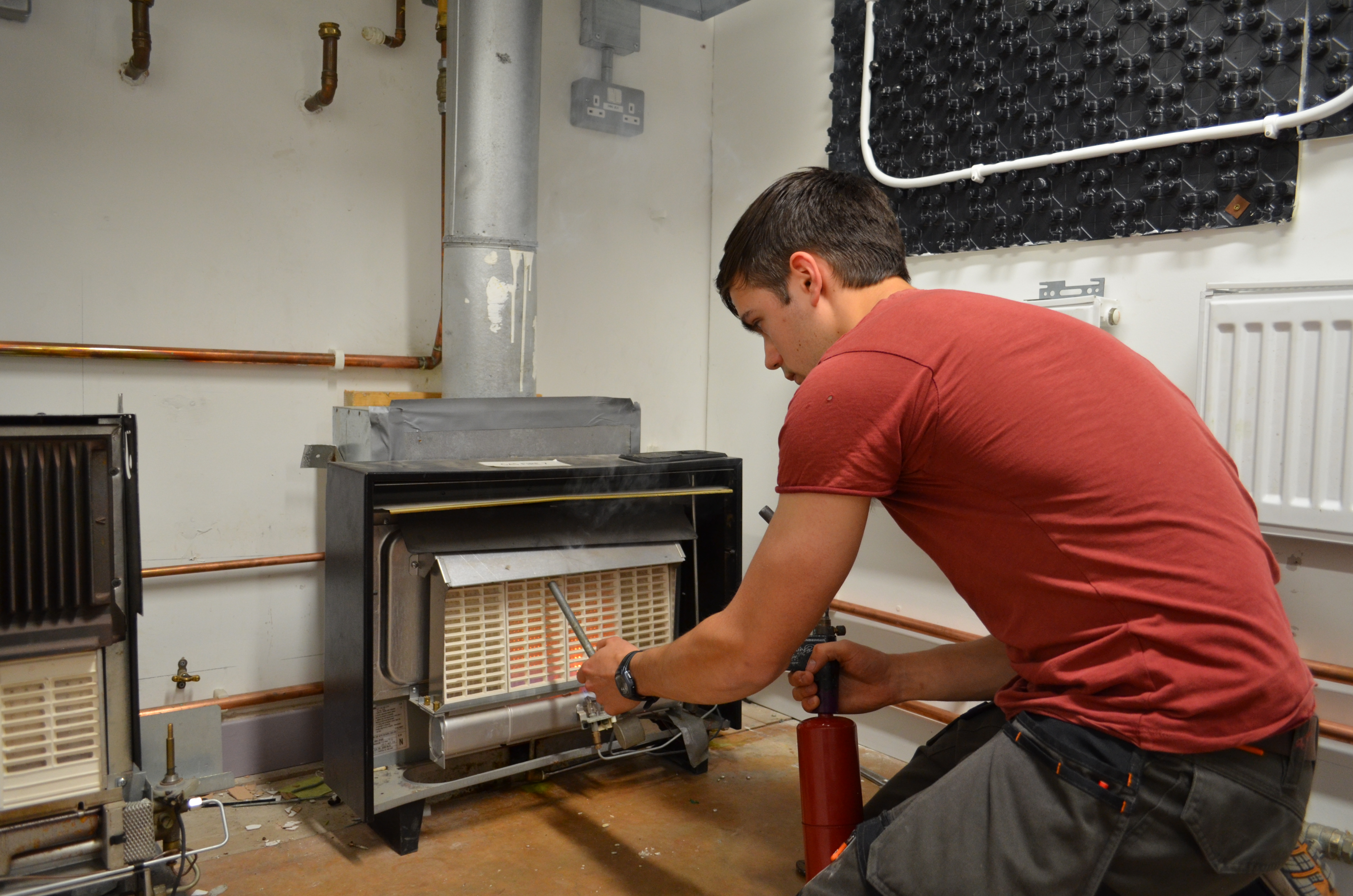 Student looking at heater as part of his HTR1 Heaters and Fires Re-assessment course.