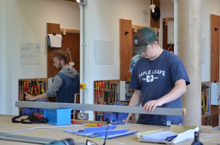 Electrical students in workshop.