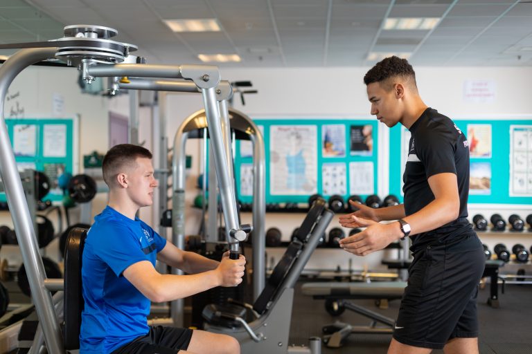 Two students training in the gym.