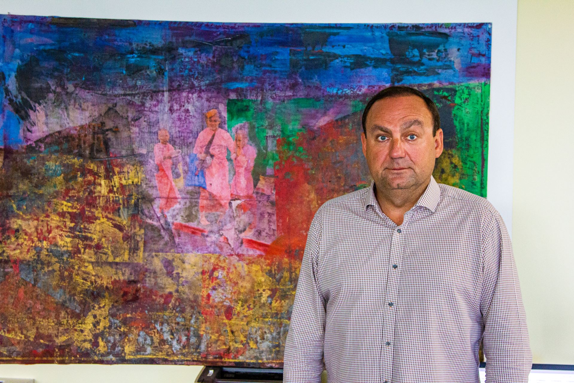 Pav standing with his artwork