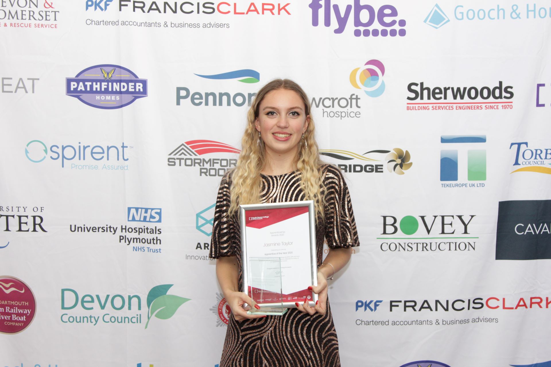 Jasmine Taylor holding Apprentice of the year certificate