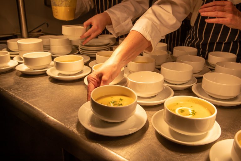 Chef's dishing up soup