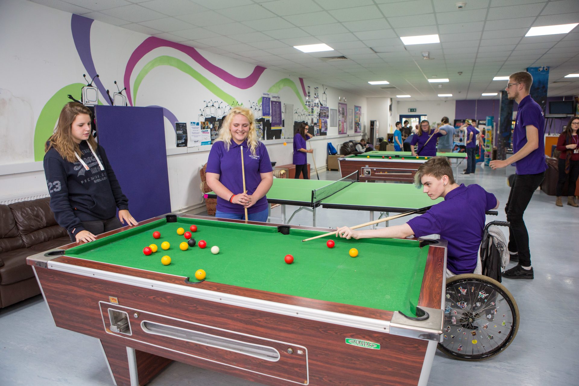 Students playing pool in the student union common room