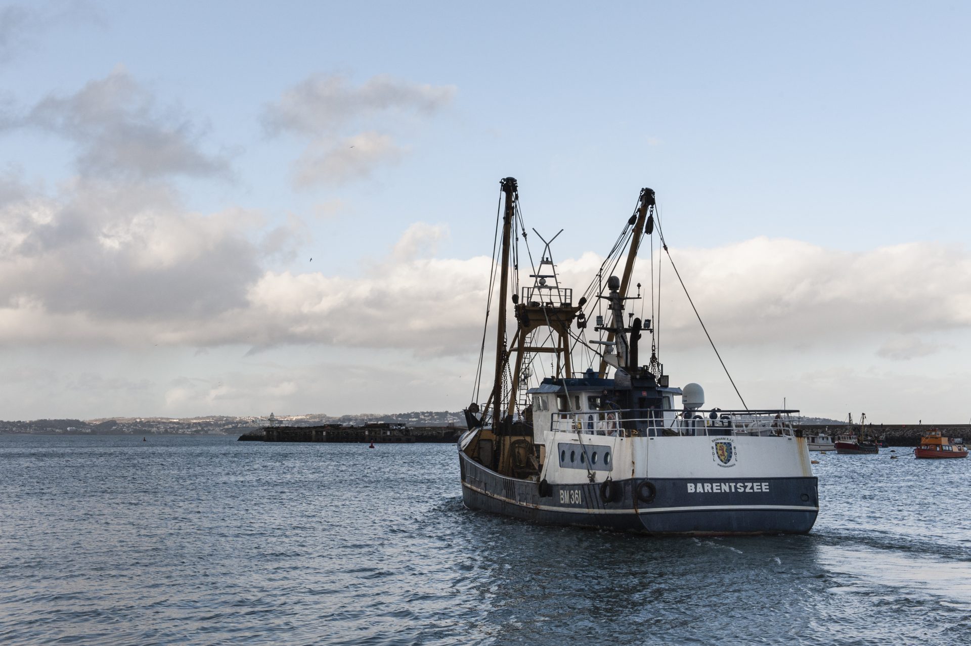 Fisher vessel setting off from the harbour docks