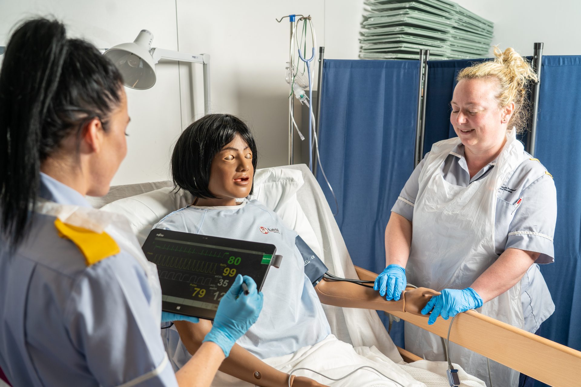 Nurses practising with a simulation doll