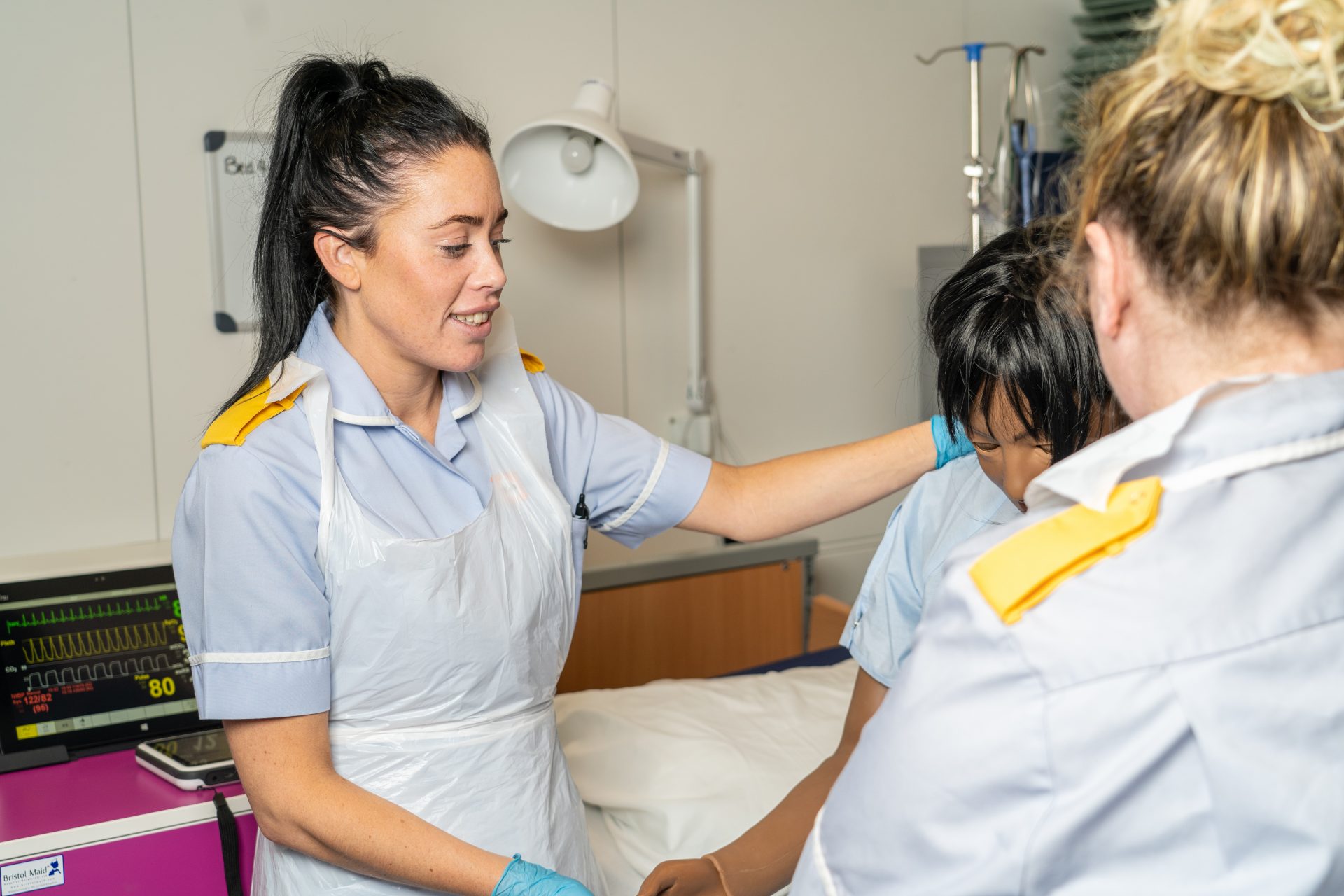 Nurses practising with a simulation doll
