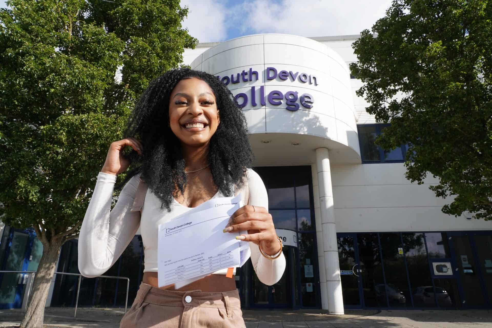 Paige Johnson celebrating on results day outside South Devon College