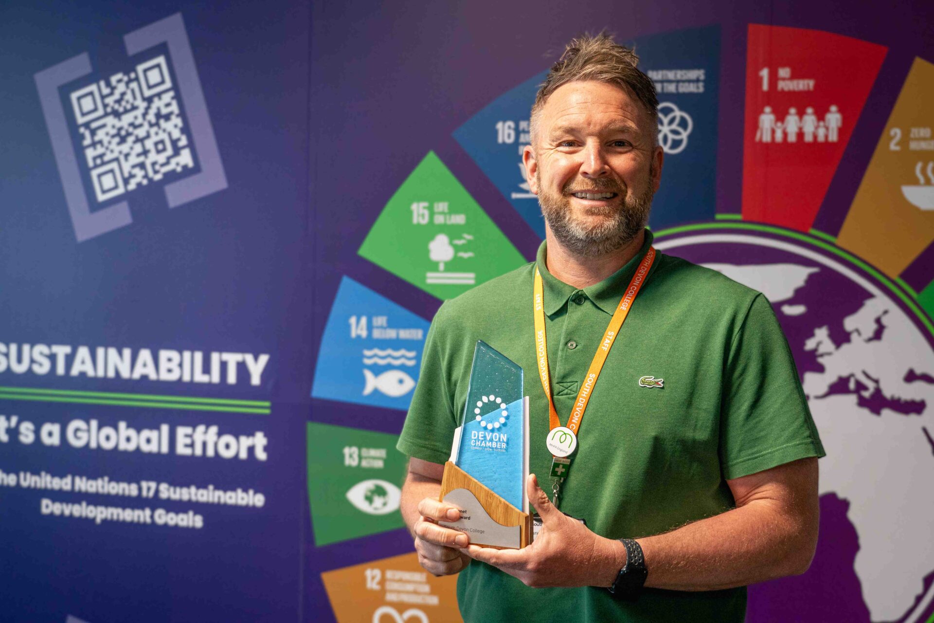 Matt Green Head of Commercial Services and Sustainability poses with Planet Saver award